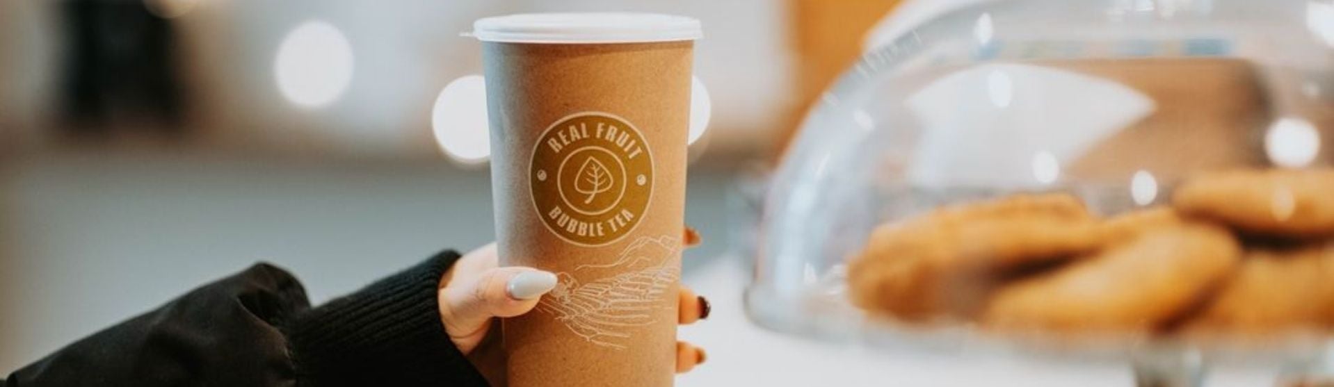 Hand holding a hot drink