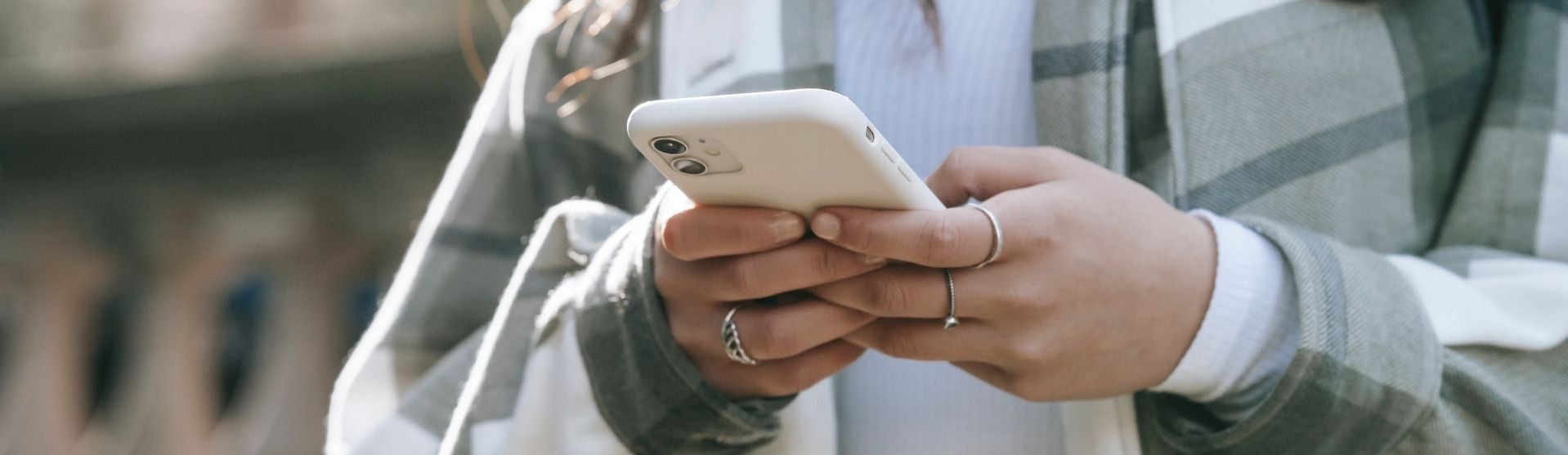 Girl texting on her iPhone
