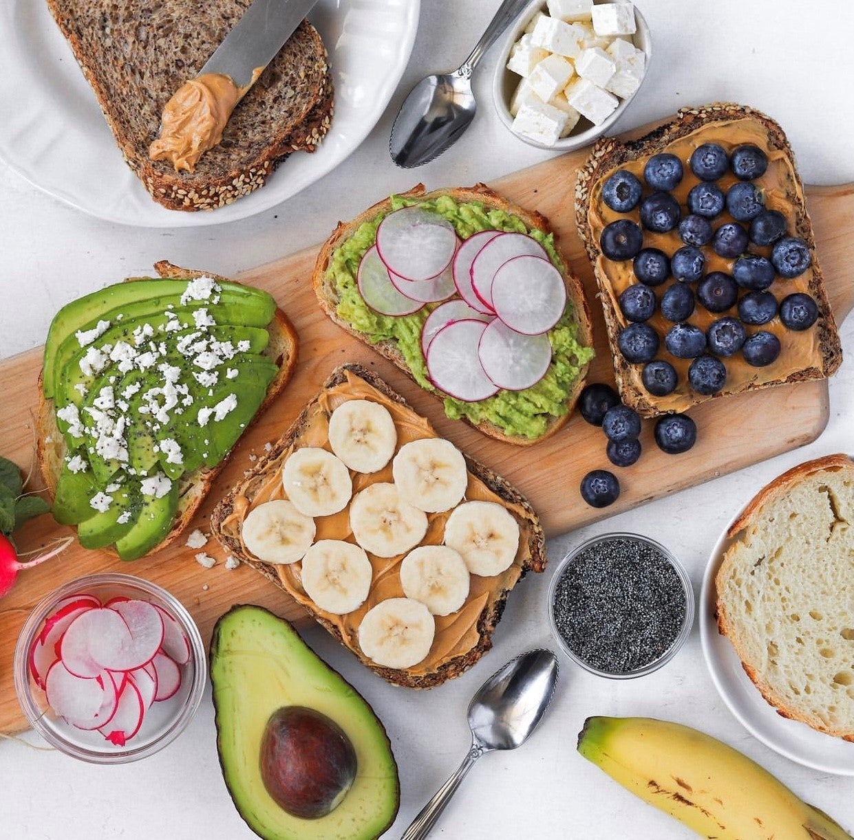 Avocado toast, banana and peanut butter toast, peanut butter and blueberry toast