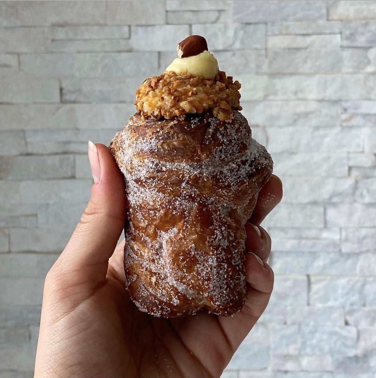 holding pastry from gouter