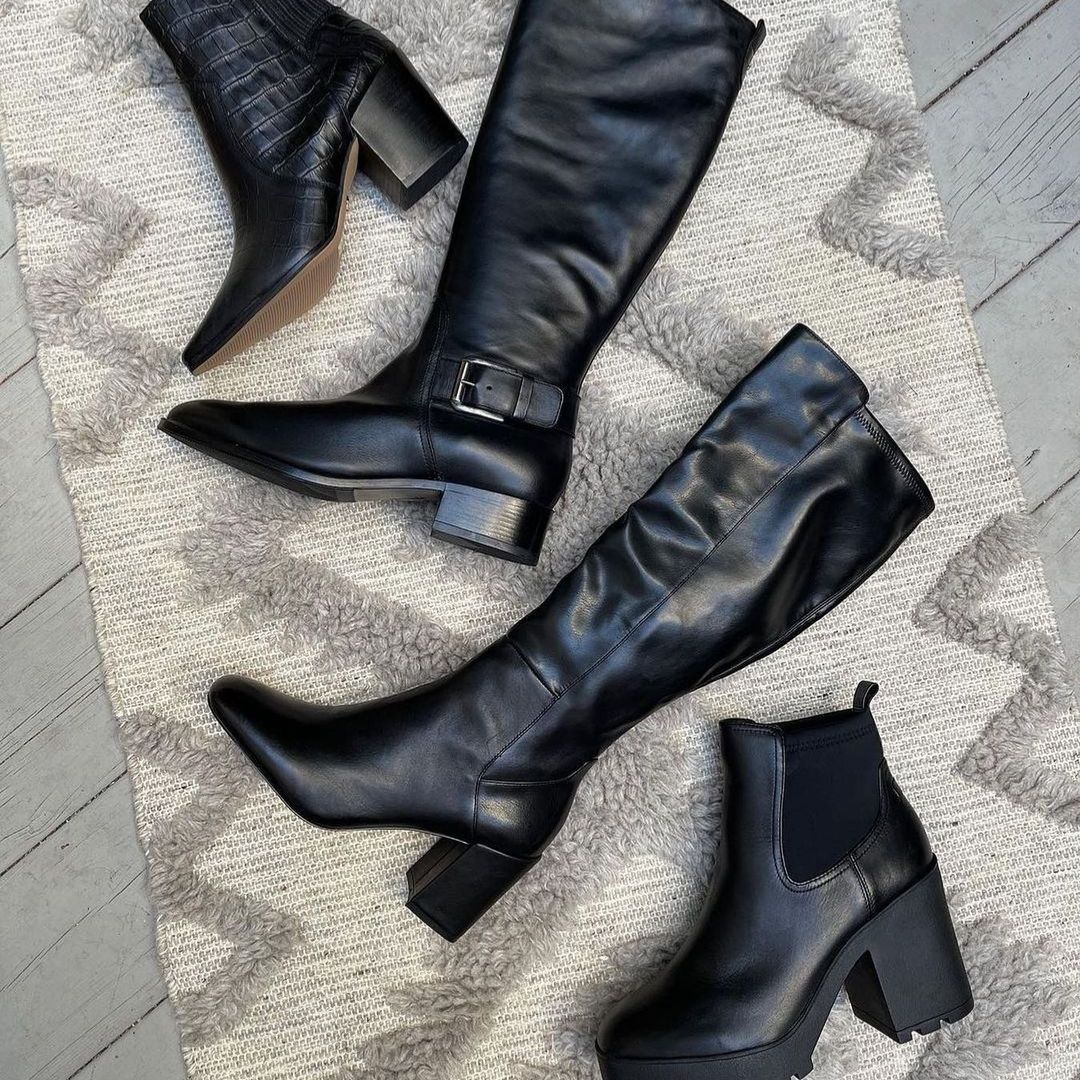 Flatlay of black leather boots